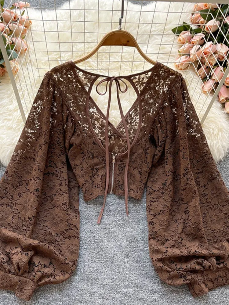 Women's elegant lace blouse with v-neckline and long sleeves open back