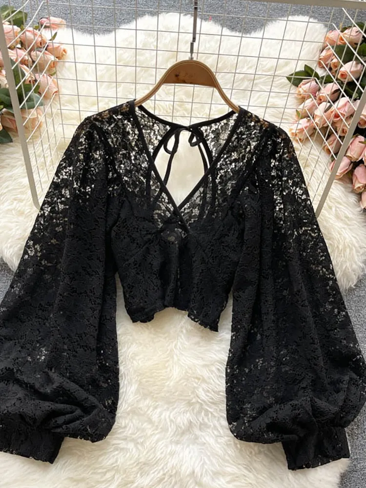 Women's elegant lace blouse with v-neckline and long sleeves open back